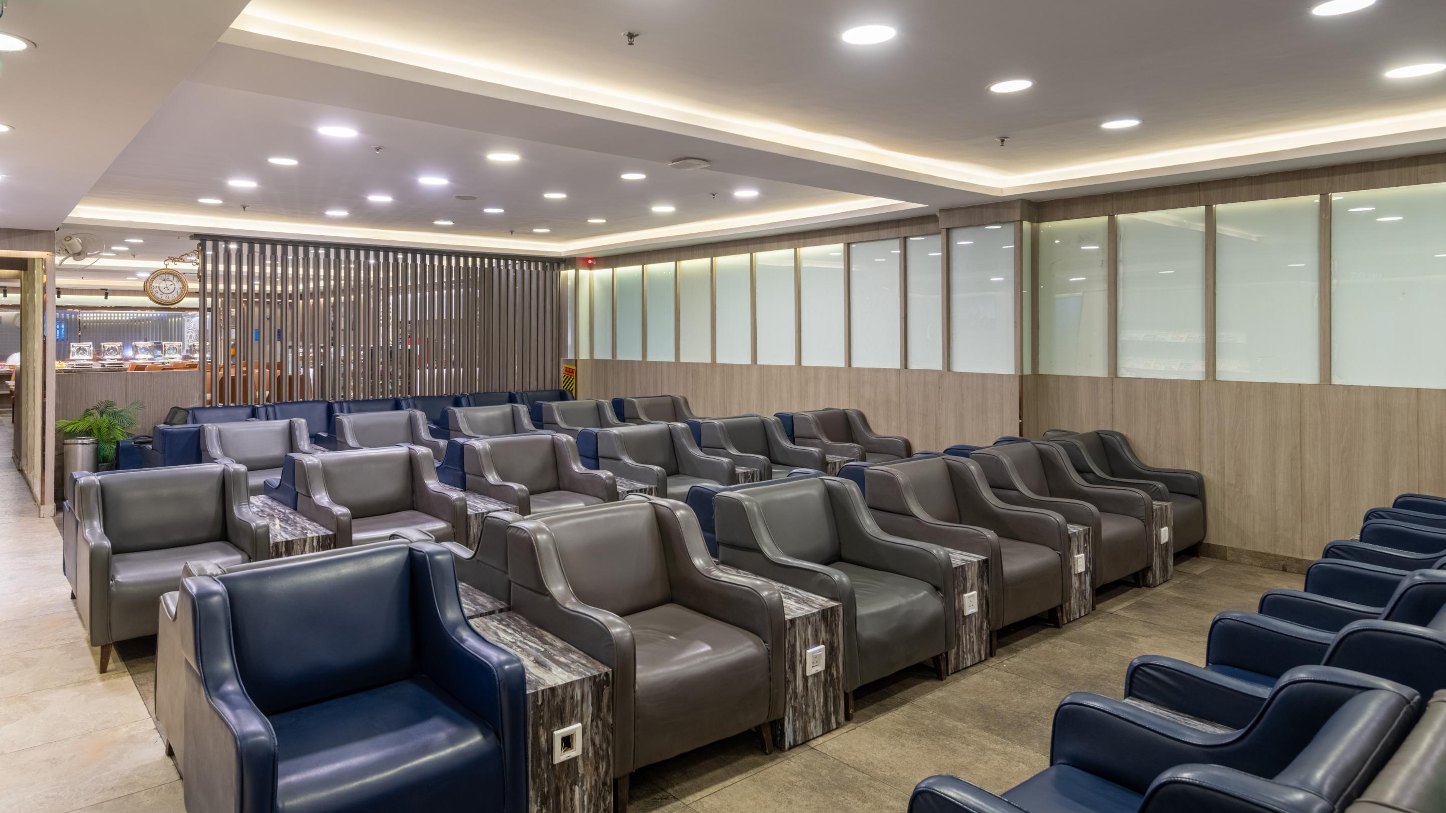 Lounge ambience with warm lighting and staff serving